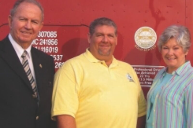 INDUSTRY PRIDE: Road Knight Doug Ladds (centre) has spread the road safety message far and wide, including to politicians such as MPP Monte Kwinter (left) and former Transport Minister Donna Cansfield (right).