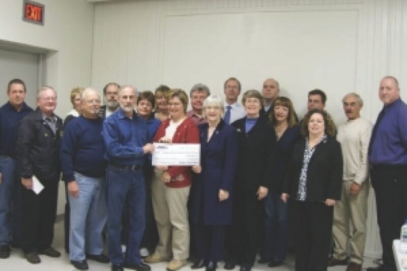 GIVING BACK: Representatives of dozens of area groups pose for pictures as the Fergus Truck Show divvies up the money raised during this year's event. Despite a slow economy, the show raised nearly $50,000 for the organizations.
