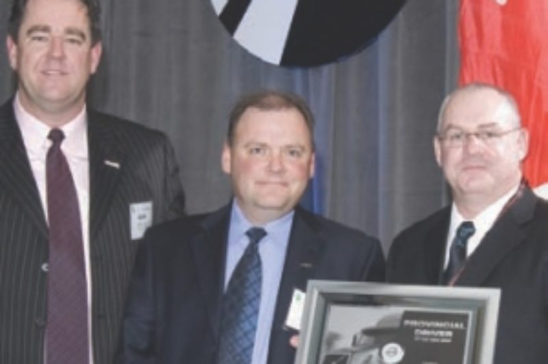 DRIVER OF THE YEAR: Luke Langlois receives his award from Kriska's Mark Seymour (left) and Volvo's Peter Currie (centre).
