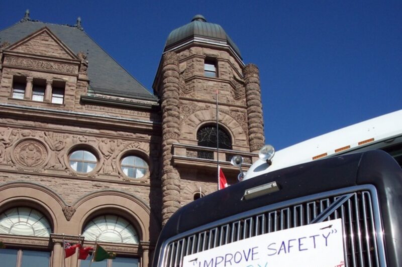 Organizer Scott Mooney parked his truck at Queen's Park with a strong message on its grille.