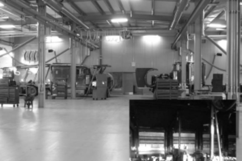 BIGGER AND BETTER: Thunder Bay Truck Centre's service shop was razed by fire (inset) just over a year ago. But the replacement is better than the original.