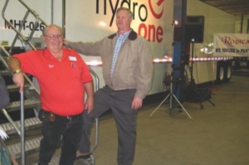 CUSTOM FIT: Bob Nothof, vice-president and general manager of Robica (left) presents Don Comeau of Hydro One with the first of six Mammoth TOT trailers.