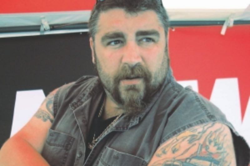 MOTORMANIA: Michael 'Motor' Rosenau wears his heart on his sleeve. The truck enthusiast proudly shows a tattoo of his friend Gord Cooper's 1957 Kenworth. Rosenau was named the 2009 Owner/Operator of the Year at the Fergus Truck Show.