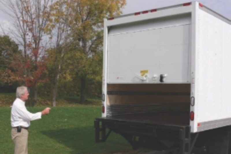 EASY TO USE: The roll-up door on this straight truck is opened with the click of a button, using the handheld keychain-type remote control.