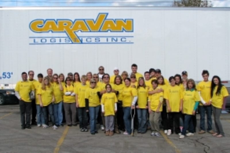 Caravan Logistics staff and their families worked with Marwan Hage of the Hamilton Tiger Cats at Ivor Wynne Stadium to hand out food boxes to needy families on Thanksgiving weekend.