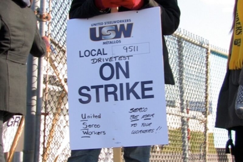 About 50 strikers arrived at KRTS headquarters just after 8 a.m. to protest Serco management testing commercial drivers on site.