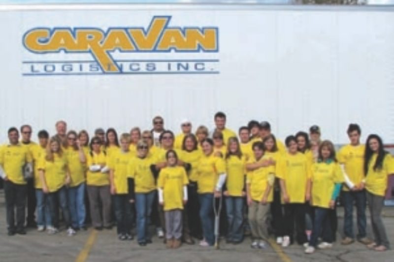 TEAM EFFORT: Caravan Logistics not only provided the equipment to haul donated food items during a recent food drive, it also provided the people to help get the job done.
