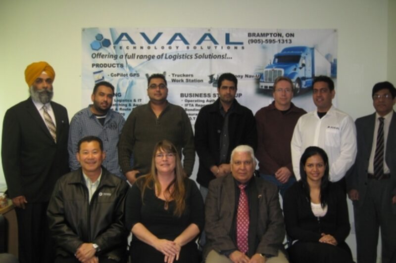 Avaal's latest group of grads poses with special guests after the ceremony in Brampton Jan. 10.