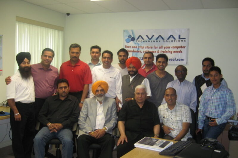 Avaal's latest group of grads poses with special guests after the ceremony in Brampton May 2.