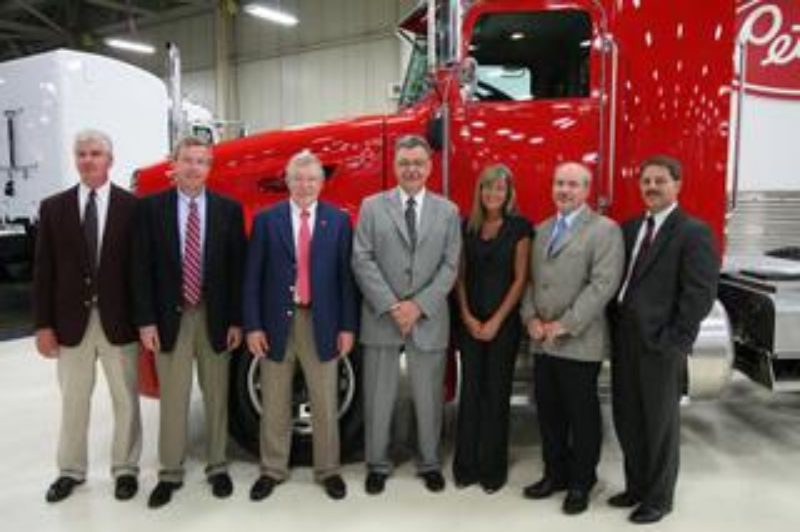 L to R: Corky Mawry Fleet Sales Manager, Hunter Peterbilt; Jeff Hunter Dealer Principal, Hunter Peterbilt; Bob Hunter Dealer Principal, Hunter Peterbilt; Bill Jackson General Manager, Peterbilt; Jan McClymonds McClymonds; Mark McClymonds; Arlen Savitt Assistant General Manager, Peterbilt.