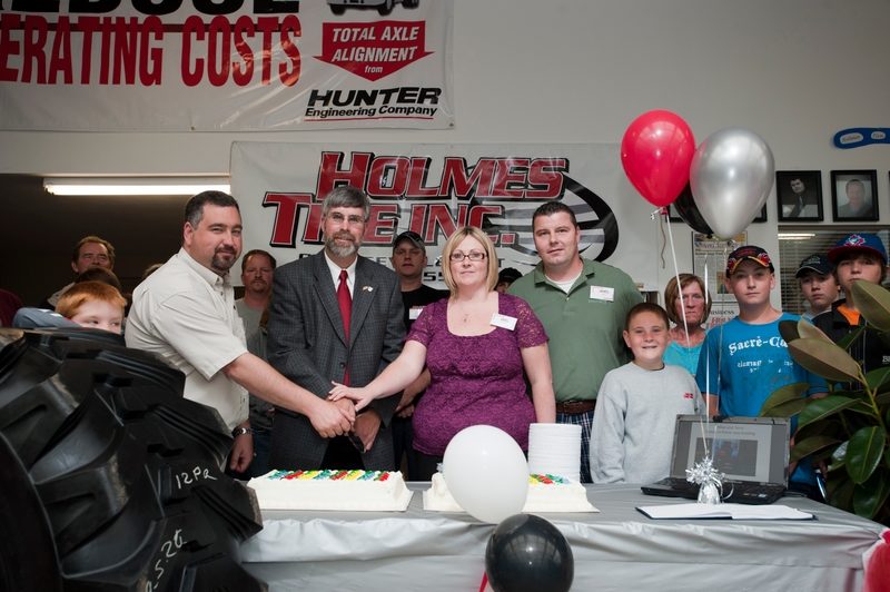 Holmes Tire held the grand opening ceremony for its new Orangeville facility June 12. Pictured from left to right are Mike Holmes, Deputy Mayor Maycock, Terry Holmes and Jim Prince.