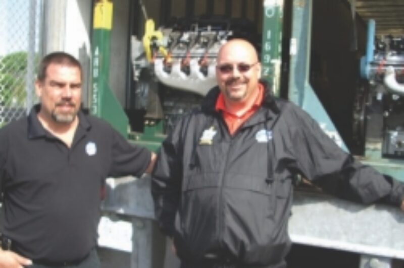 SPECIAL DELIVERY: Warehouse manager Lance Lund (left) and APPS driver and OTA Road Knight Guy Broderick prepare to unload some new GM engines at Central Technical Institute in Toronto.