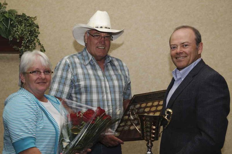 Howard McAfee, pictured with wife Theresa and Allan Smeall, won Manitoba's Grand Champion award.