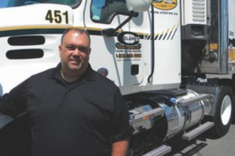 READY TO ROLL: Fleet manager Sean Simpson shows off one of the new additions, a Mack Pinnacle day cab with MP8 engine.