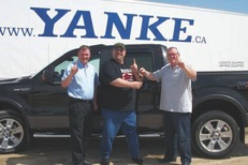 SAFETY PAYS: Pictured, from left to right is Bill Kalbhenn (director of fleet safety and recruiting), Brian 'Huggy' Halabura (award-winning Yanke operator) and Craig Bailey (v. p. of YMS, YGLS, YSCS).