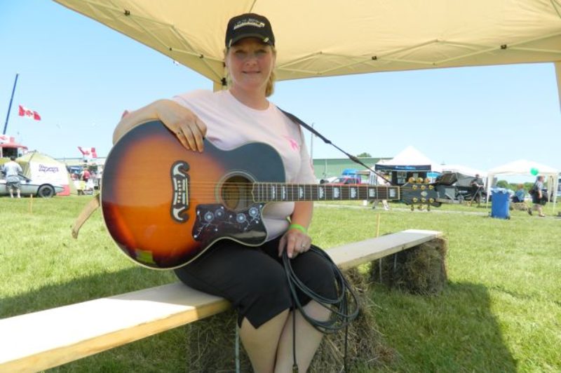 Anne Finley is pictured after performing her song Convoy for a Cure at the Stirling Truck Show. Proceeds from the sale of the song on CDBaby.ca and hopefully iTunes will be donated to the Canadian Breast Cancer Foundation.