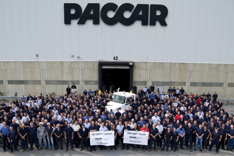 Employees at Paccar's Ste-Therese, Que. facility gather to celebrate the production of the plant's 100,000th medium-duty truck - a Kenworth T370 for Altec Industries.