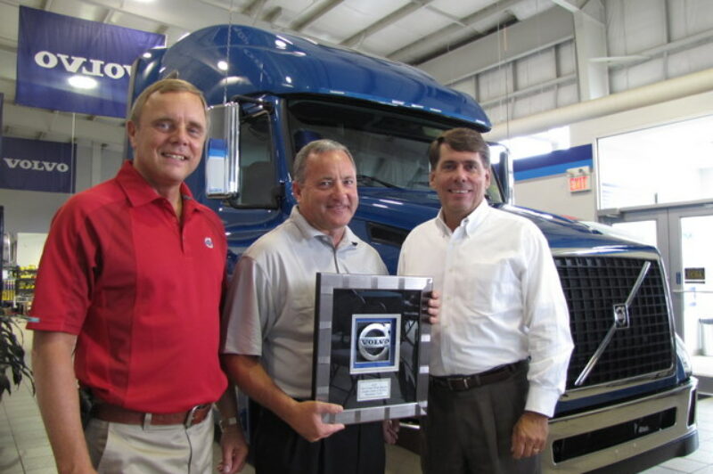 DYNAMITE DEALER: Volvo executives gather at Expressway Volvo near Waterloo, Ont. to celebrate the facility's Dealer of the Year award win. Pictured from left to right are Brent Weary, regional vice-president, sales and marketing, Volvo Trucks Canada; Scott Lawson, dealer principle, Expressway Volvo; and Ron Huibers, senior vice-president of sales and marketing, Volvo Trucks North America.