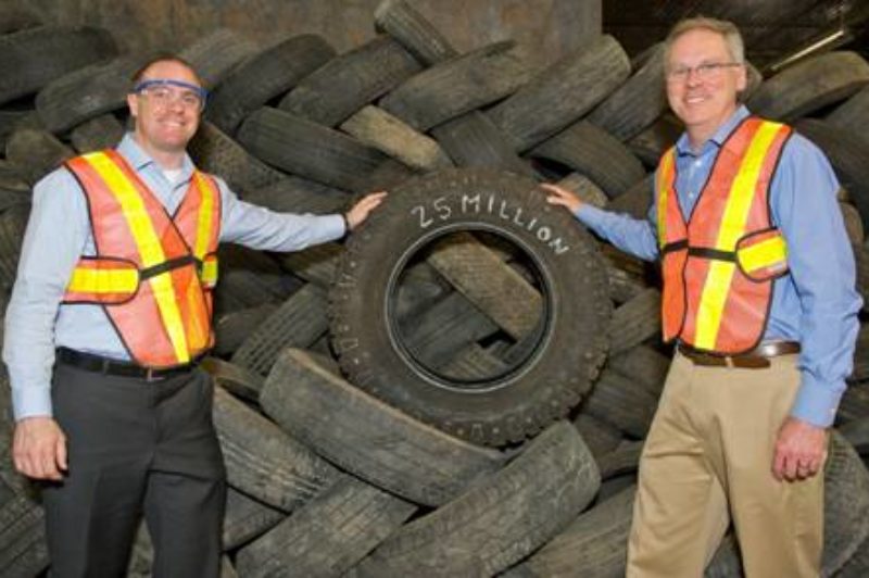 Ontario's Minister of the Environment John Wilkinson (right) celebrates the recycling of 25 million tires in Ontario alongside Andrew Horsman, executive director of Ontario Tire Stewardship.