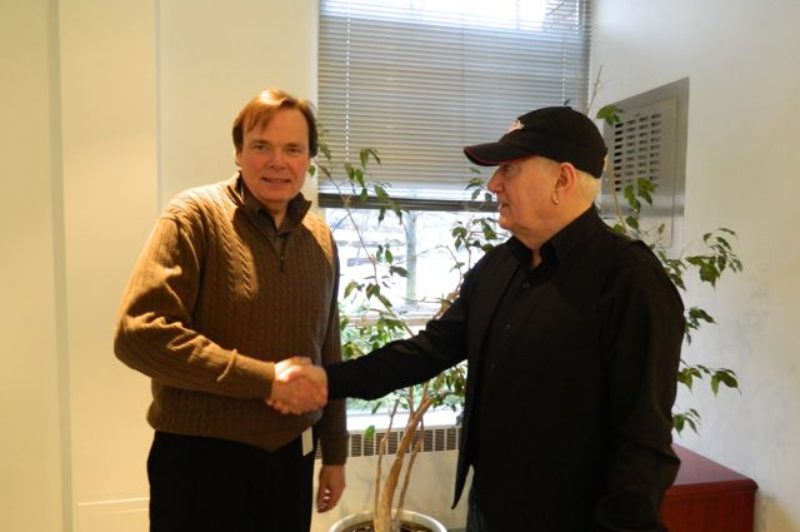 Truck News publisher Rob Wilkins (left) agrees to a deal with Alexis Broadcasting co-owner Stan Campbell to promote and produce a new radio program called Trucker Radio.