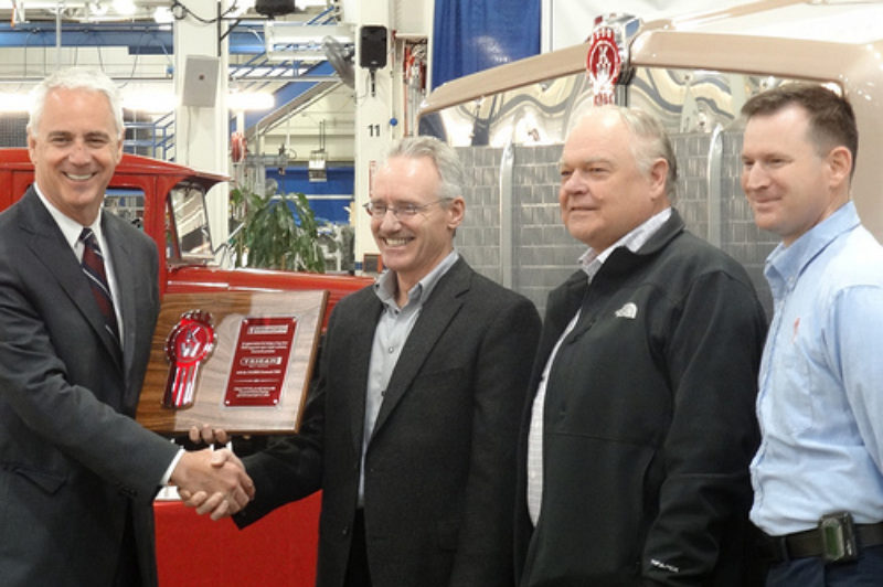 The historic 250,000th Kenworth T800 was received by Trican Well Service during a special ceremony held at the Kenworth assembly plant in Renton, Wash. From left are Gary Moore, Kenworth general manager and PACCAR vice-president; Trican's Don Luft, president and chief operating officer; and Ben Mikulski, corporate manager of equipment standards and R&M services; and Daryl Simon, Kenworth - Renton plant manger.