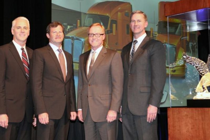 Edmonton Kenworth is honored with the 2011 Kenworth Dealer of the Year Award. From left are Gary Moore, Kenworth general manager; Edmonton Kenworth executives Collin Ferguson and Gary M. King; and Preston Feight, Kenworth assistant general manager - marketing and sales.