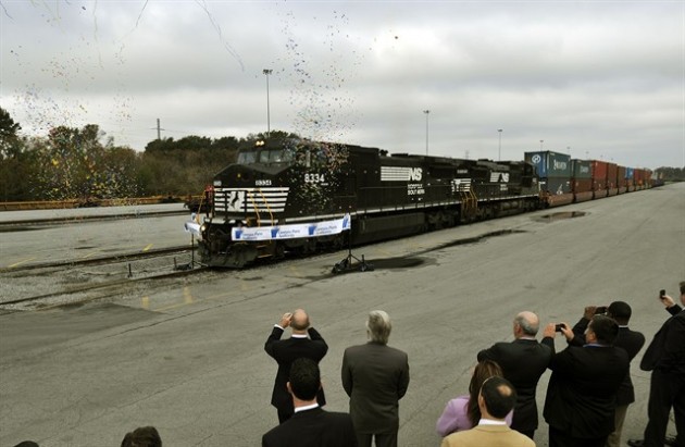 Two Norfolk Southern 4,400-horsepower locomotives break a ribbon during a ceremony celebrating the grand opening of the Georgia Ports Authority James D. Mason intermodal container transfer facility in Savannah, Ga earlier today.