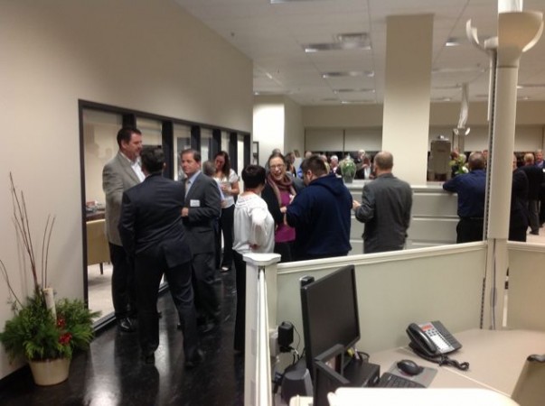 Kriska CEO Mark Seymour (far left) mingles with guests at an open house Nov. 21.