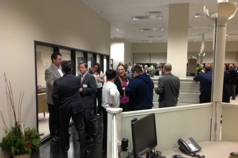 Kriska CEO Mark Seymour (far left) mingles with guests at an open house Nov. 21.