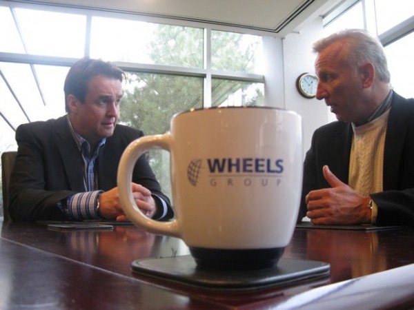 Mike McCarron (left) and Wheels Group CEO Doug Tozer talk about the deal.