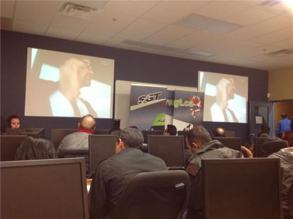 triOS College chairman and CEO Frank Gerencser speaks with potential students at the Trucking Career Expo, held at the school's Brampton campus Feb. 12. The event was so well attended, an overflow room was set up to accommodate the extra numbers.
