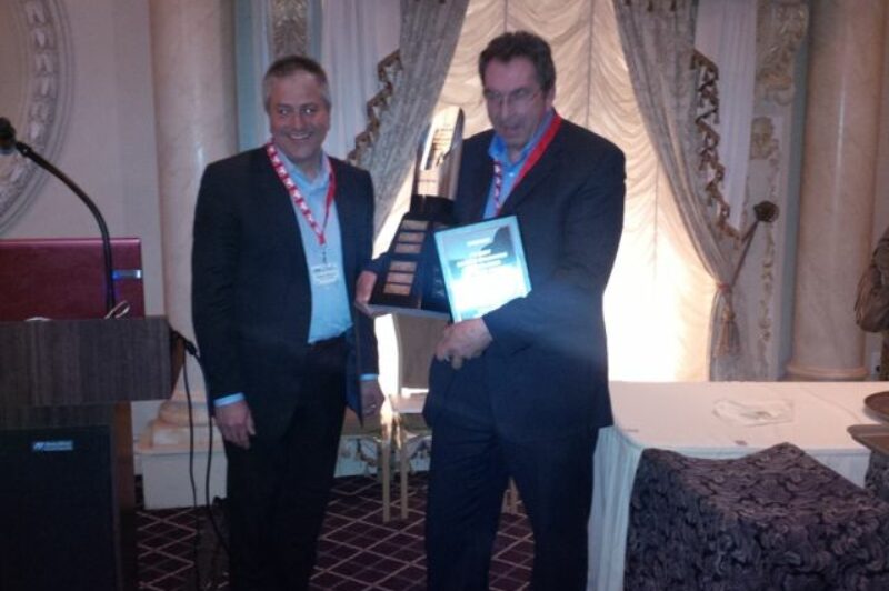 Volvo's Steve de Sousa (left) presents the Canadian Fleet Maintenance Manager of the Year award to John Haines, national fleet director for Canada Cartage.