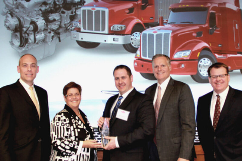 Peterbilt Motors Company presents Caminos Excellence Peterbilt - Laval the award for Peterbilt's Parts and Service North American Dealer of the Year. From L to R: Darrin Siver, Paccar Parts general manager and Paccar vice-president; Nicole Lussier, Camions Excellence Peterbilt - Laval; Dany Lussier, Camions Excellence Peterbilt - Laval; Bill Kozek, Peterbilt general manager and Paccar vice-president; and Tony McQuary, Paccar Parts general sales manager.