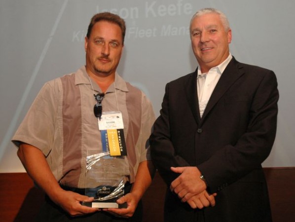 Mark Mostacci of TDL Group (left) receives a PMTC-Zurich Private Fleet Safety Award.
