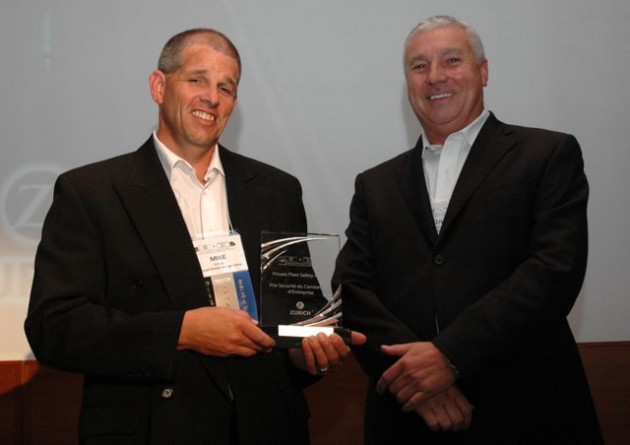 Mike Millian of Hensall District Co-op (left) accepts a PMTC-Zurich Private Fleet Safety Award for most improved safety record.