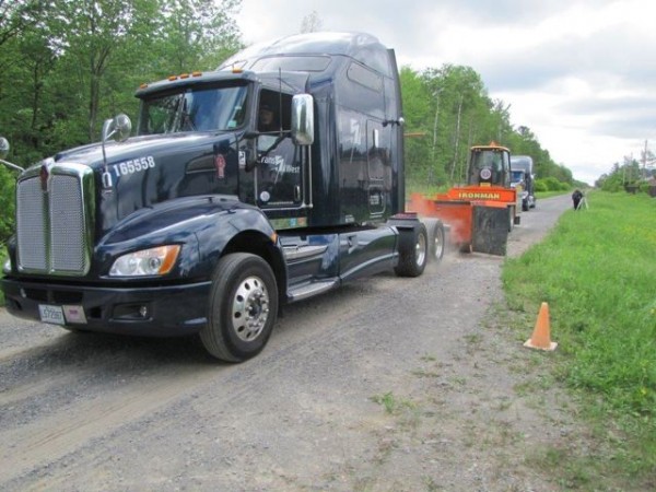 A PIT crew does traction tests on a tractor during drive axle trials.