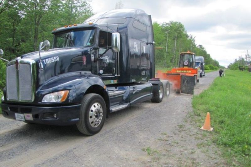 A PIT crew does traction tests on a tractor during drive axle trials.