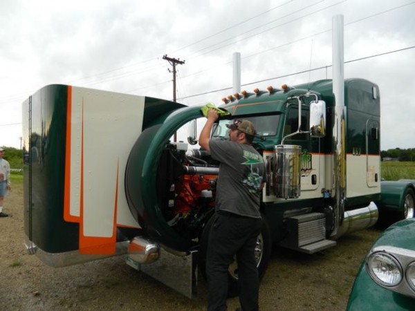 Martin Warner, a driver for Manitoba-based Jade Transport, polishes a Pete 388 at the Shell Rotella SuperRigs show.