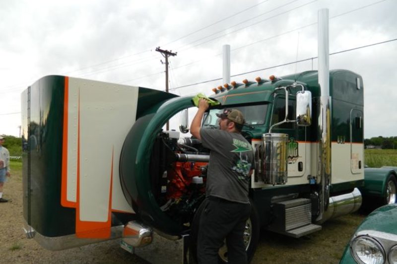 Martin Warner, a driver for Manitoba-based Jade Transport, polishes a Pete 388 at the Shell Rotella SuperRigs show.