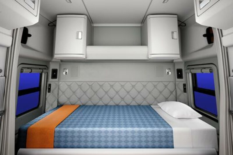 The mid-roof sleeper features a liftable lower bunk and upper storage units on the sleeper's back wall, including hanging storage for drivers to hang their clothes and jackets, or an optional upper bunk for driving teams. A bunk heater, flat screen TV and premium sound system can also be added.