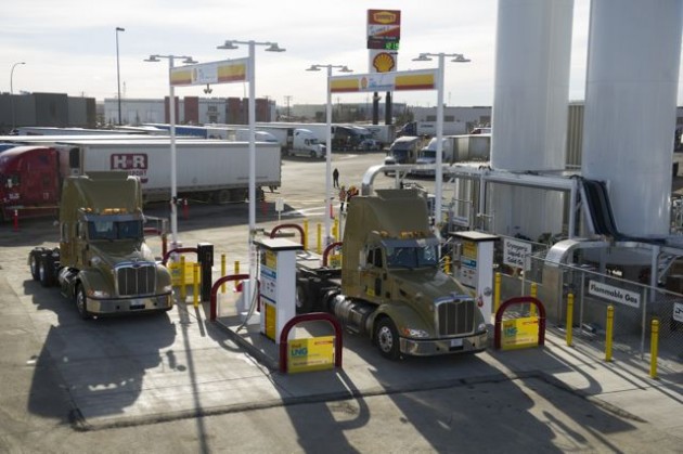 Two LNG-fuelled Bison Transport trucks are parked at the fuel island at Shell's first commercial LNG filling station.