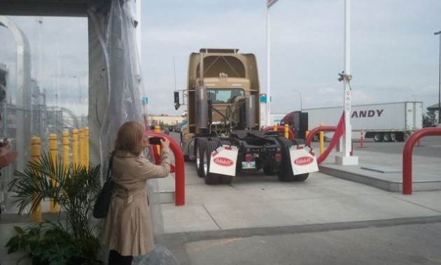 Instead of the traditional ribbon-cutting ceremony, an LNG truck drove through the ribbon to celebrate the fuelling station's opening.