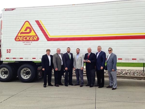Great Dane recently built the 100,000th trailer out of its Wayne, Nebraska plant. Pictured (L-R): Chris Hammond, Great Dane Vice President of Dealer and International Sales; Darv Habben, Crossroads Trailer President; Mark Habben, Crossroads Trailer; Dale Decker, Decker Truck Line Vice President; Don Decker, President and CEO of Decker Truck Line; Dean Engelage, Great Dane President; Terry Hanson, Great Dane Wayne Plant Manager.