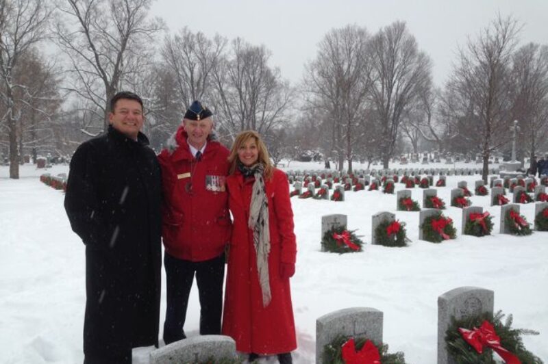 From left-to-right: Rob Penner, Craig McPhee and Kathy Penner lay wreaths at the Beechwood National Cemetery.