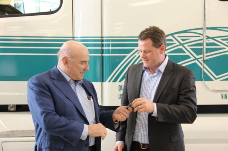 Peterbilt's Matt Preston hands the keys of this Pete 579 to TransX president Louie Tolaini.