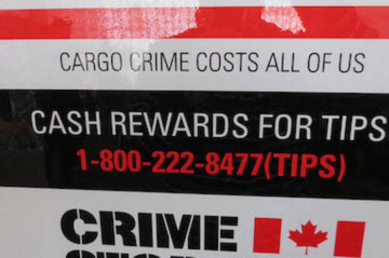 The posters include the 1-800 phone number for reporting tips about crimes and information about stolen property.