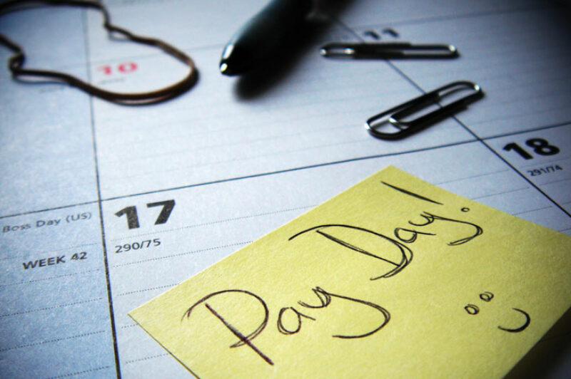 Some say hourly wages help retain staff and reduce financial stress on drivers. Others say they hurt the bottom line.