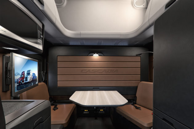 New Cascadia 72 Raised Roof Sleeper Cab featuring Elite Lounge Package with Driver’s Loft and upper cargo shelf shown in Saddle Tan and Black alternate text for this image