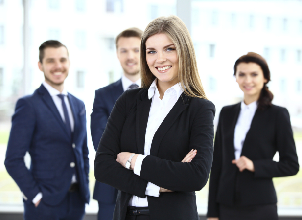 Face of beautiful woman on the background of business people alternate text for this image