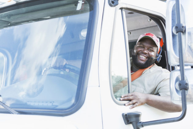 African-American truck driver in driver’s seat alternate text for this image
